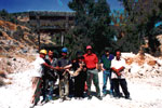 Artist posing with quarry workers